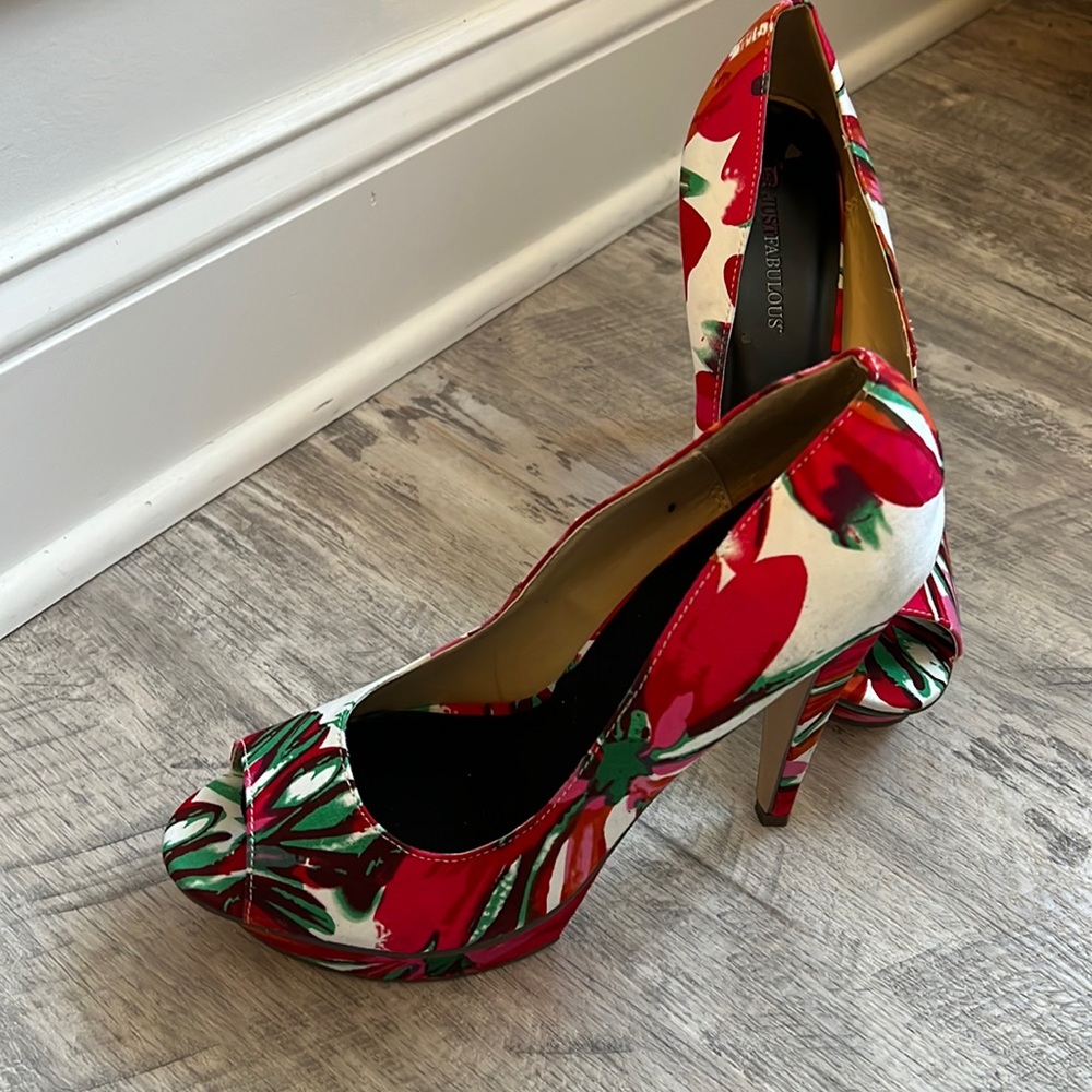 Worn once floral platforms.  Peep toe design.